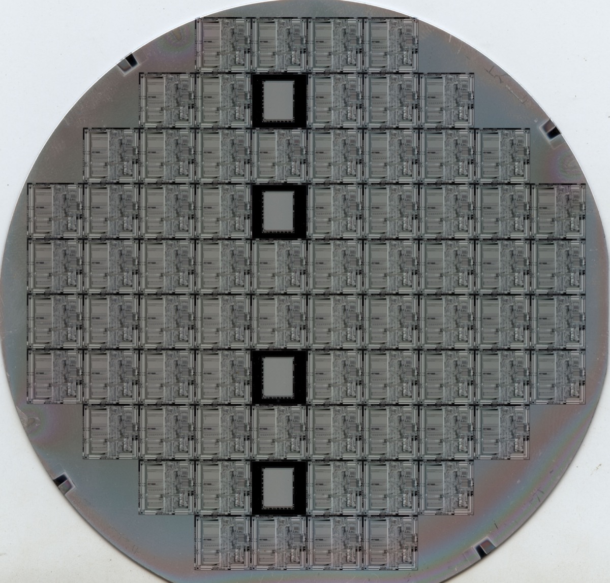 Semiconductor wafer manufacturing showing chip fabrication processes
